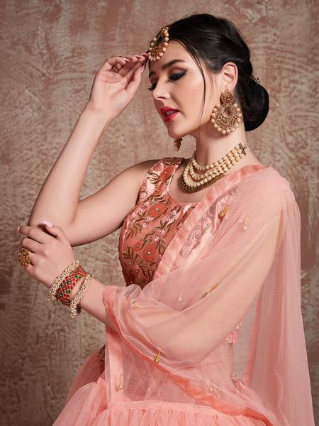 Women's  Peach Soft Net Heavy Embroidered Lehenga