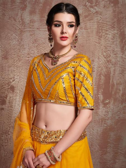 Women's  Musturd Soft Net Heavy Embroidered Lehenga