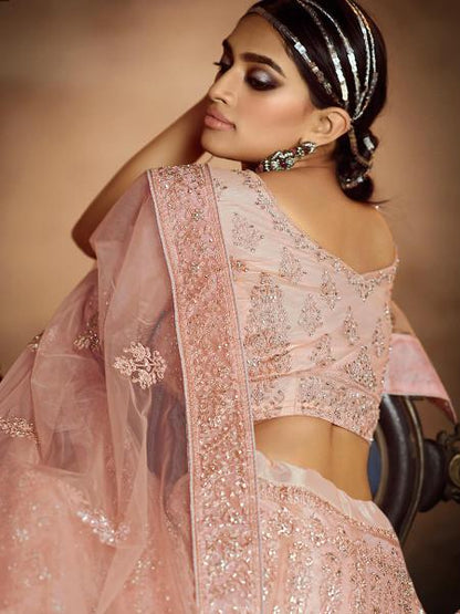 Women's  Peach Soft Net Heavy Embroidered Lehenga