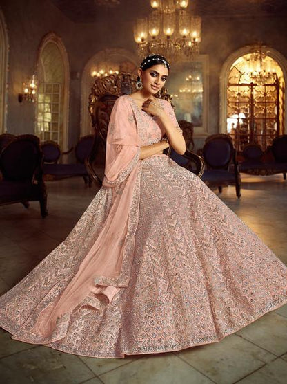 Women's  Peach Soft Net Heavy Embroidered Lehenga